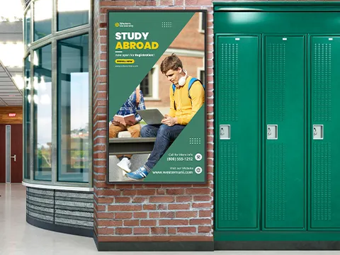 a digital display on a wall near lockers in a school hallway