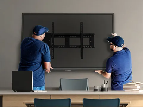 two men installing a ViewBoard using a wall mount