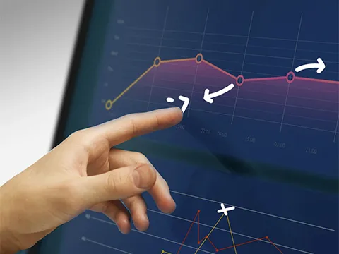 someone drawing on a touch screen display with their finger