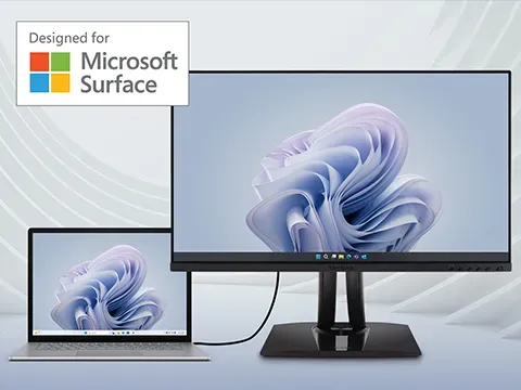 a woman wearing headphones games on an ultrawide display